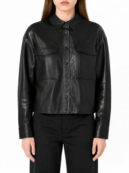 Women's black leather shirt jacket on model, front hero view