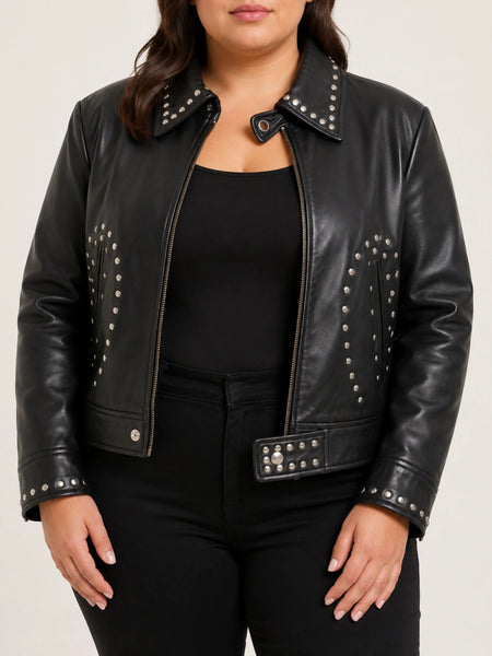 Women's black leather studded jacket on a plus-size model, studio hero image