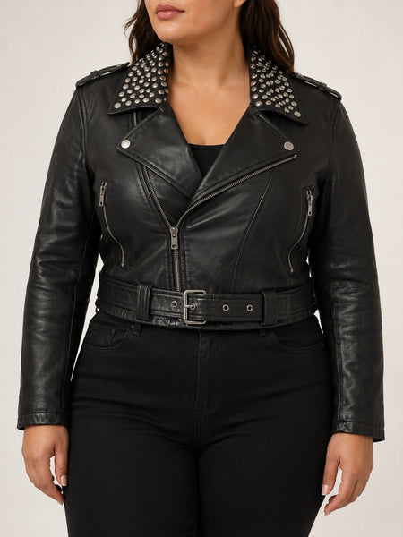 Women's black cropped studded biker jacket on a plus-size model, studio hero image