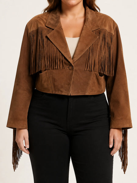 Women's warm brown cropped suede fringe jacket on a plus-size model, studio hero image